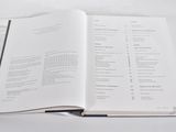 an open book on a table with a number of pages