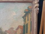 a picture of a painting on a easel in a room
