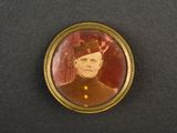 an old photo of a man in a military uniform with a hat on