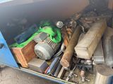 a blue truck with a bunch of tools inside of it