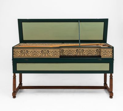 a green and gold painted bench with a mirror on top