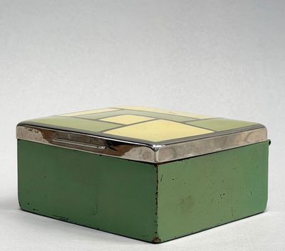 a small green box with a yellow and white design on it