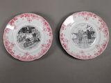 two pink and white plates with a picture of a man and a woman on them