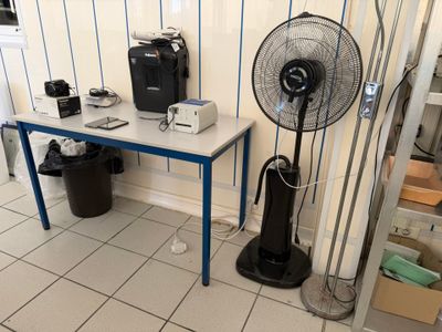 a table with a fan on it in a room
