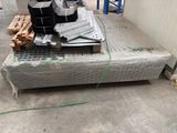 a pile of boxes and boxes on a pallet in a warehouse