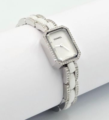 an image of a close up of a wrist watch on a napkin