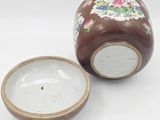pair of brown and white vases with floral designs on them