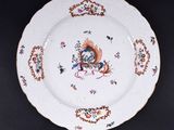 a plate with a design on it on a black table