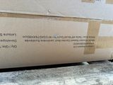 boxes stacked on top of each other in a pile on a bench