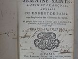 an old book with writing on it sitting on top of a table