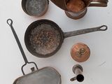 many different types of pots and pans on the table