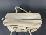 an image of a white handbag with a zipper on it