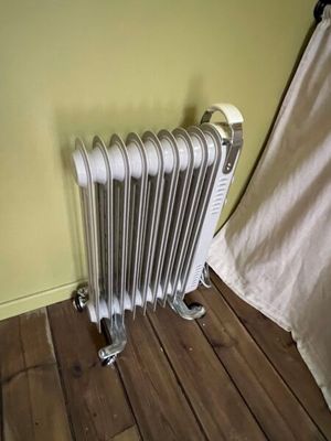 a radiator that is on the floor in a room