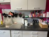 a small kitchen with a sink and a counter top