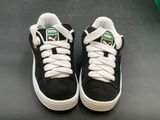 a pair of black and white shoes with white laces