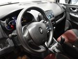 a steering wheel and dashboard of a car in a car showroom