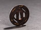a small black piece of metal with writing on it
