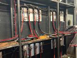 many wires that are on the shelves in the room
