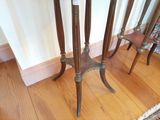 a small table with two chairs next to it on a hard wood floor