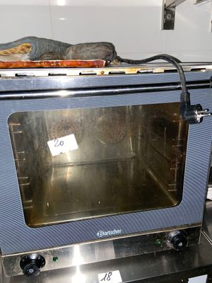a silver oven with a blue door and a black handle
