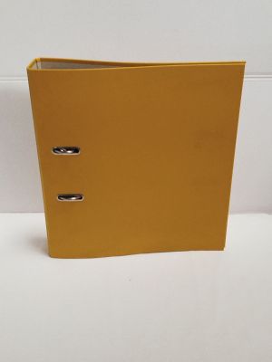 an image of a yellow binder sitting on top of a white table