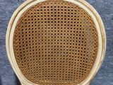 a close up of a wooden chair with a brown seat