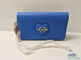 a close up of a blue purse with a heart on it