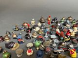 many different types of figurines sitting on a table