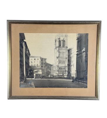 an old photo of a city street with a clock tower in the background