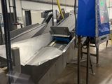 an image of a factory with a conveyor belt