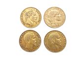 three gold sovereigns, one of which is a sovereign and the other of which is a sovereign