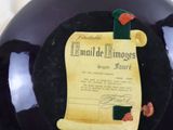 a black glass ball with a paper on it