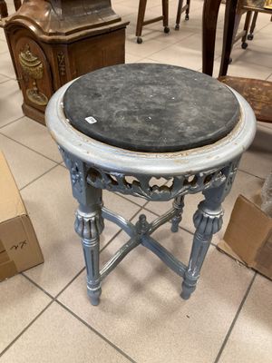 a small table that has a black top on it