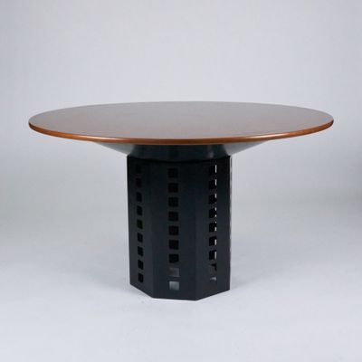 an image of a round table with a wooden top and a metal base