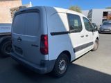 a white van that is parked in a parking lot