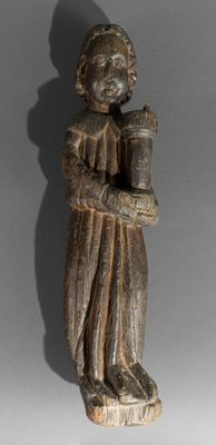 an image of a statue of a man holding a book