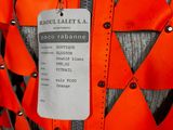 a label on a vest that says, ' ronel laett ' s a '