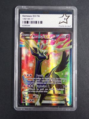 a close up of a pokemon card in a plastic case