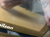 a close up of a person opening a microwave door