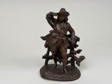 figurine en bronze représentant un homme avec un chien et un chat