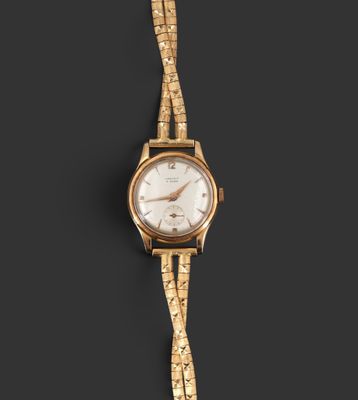 une montre-bracelet pour femme en or 18 carats avec un cadran blanc