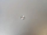 a silver laptop with a red dot on the screen