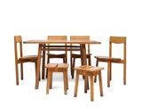 four chairs and a table with a wooden top