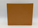 a brown cardboard box on a white surface with a white background