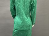 a mannequin dress with a green jacket on a mannequin mannequin mannequin mann