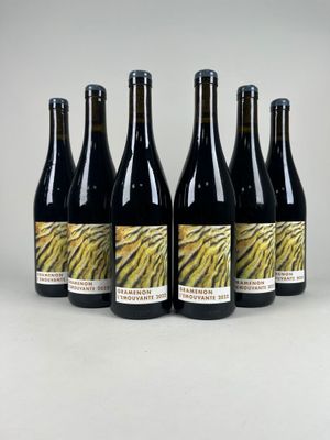 six bottles of wine sitting on top of a table