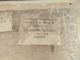 a plaque on the wall of a building that says it is the gourmet gallery