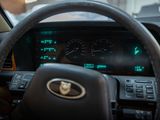 a car dashboard with a steering wheel and gauges
