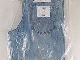 the back of a pair of light blue jeans wrapped in plastic