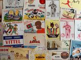 many different types of advertising posters on the wall
